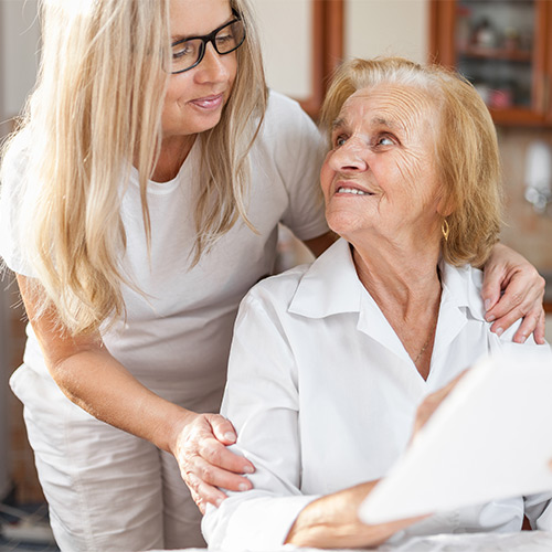 wellassist-app-woman-helping-elderly